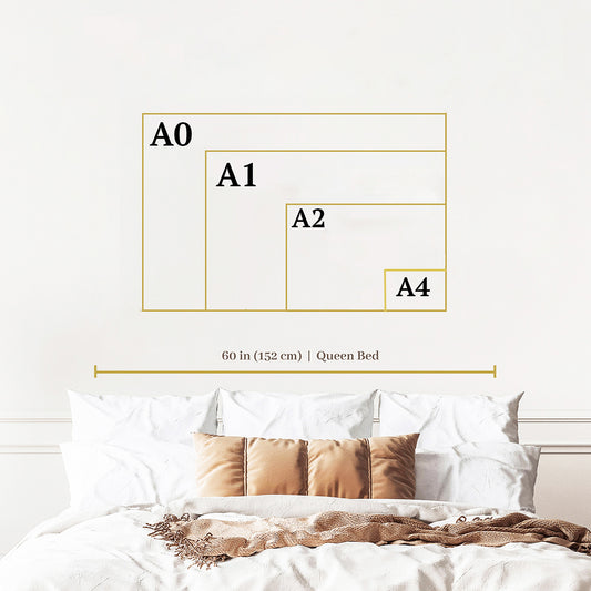 a bed with a white comforter and a white wall