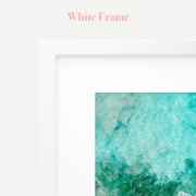 a white frame with a picture of the ocean