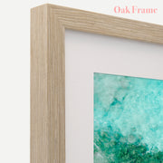 a picture frame with a picture of a green ocean